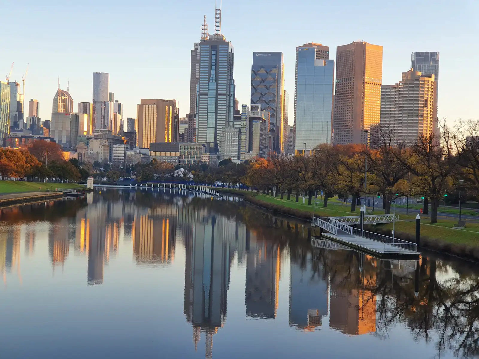 The Melbourne skyline reflected in the Yarra River in autumn