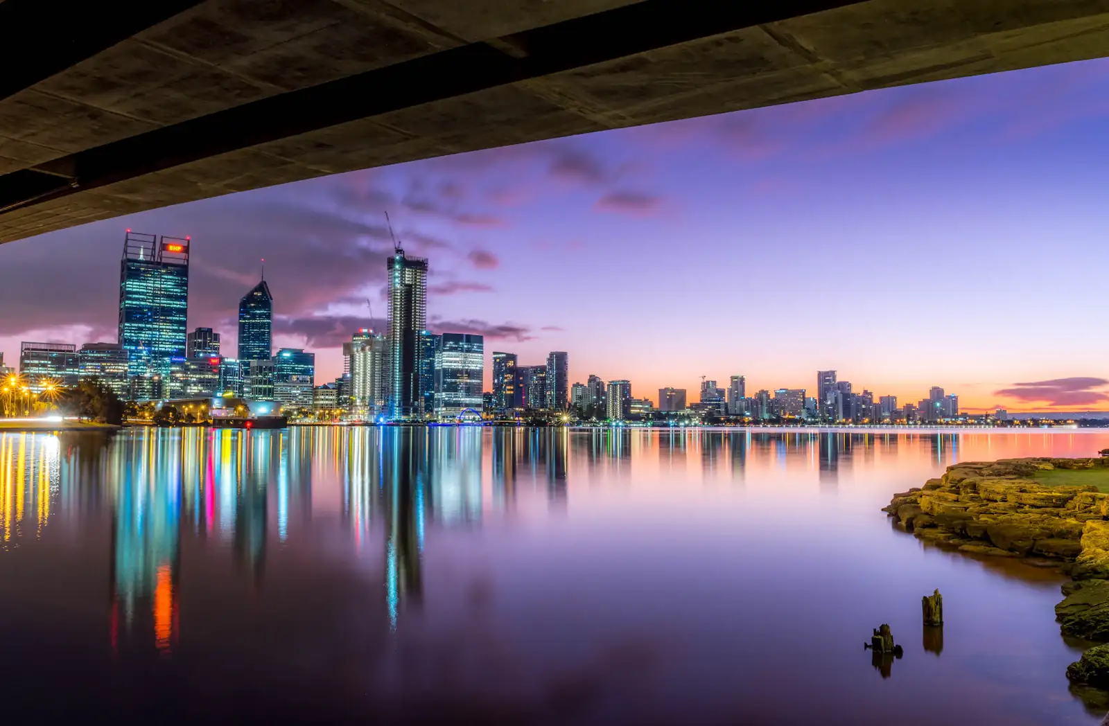 The Perth skyline reflected in the Swan River at dusk