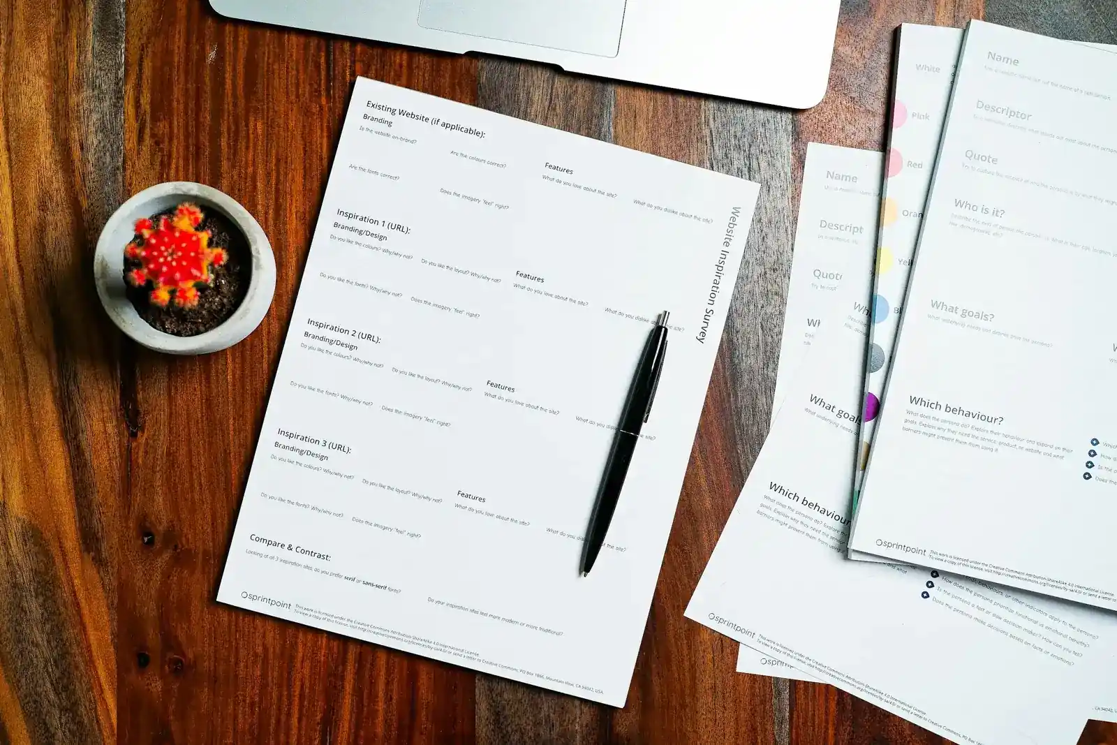 Financial documents and a pen on a desk
