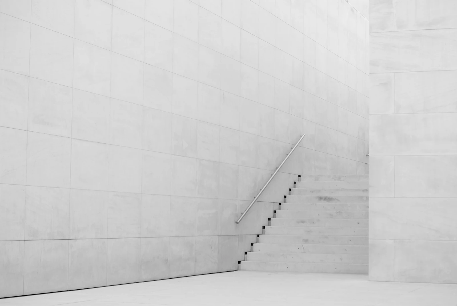 White concrete stairs rising in soft light