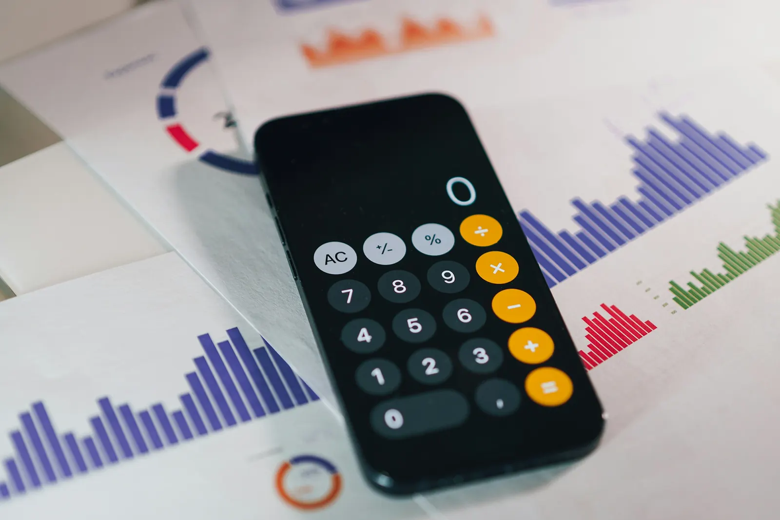 A financial report beside a calculator
